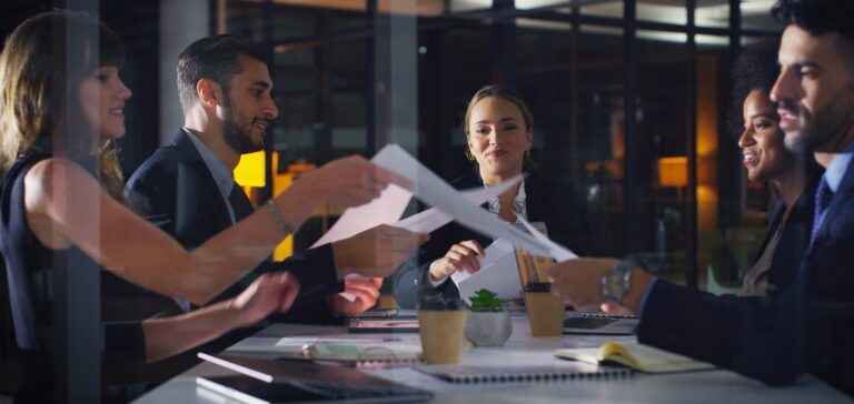 Attorneys reviewing documents around a conference table