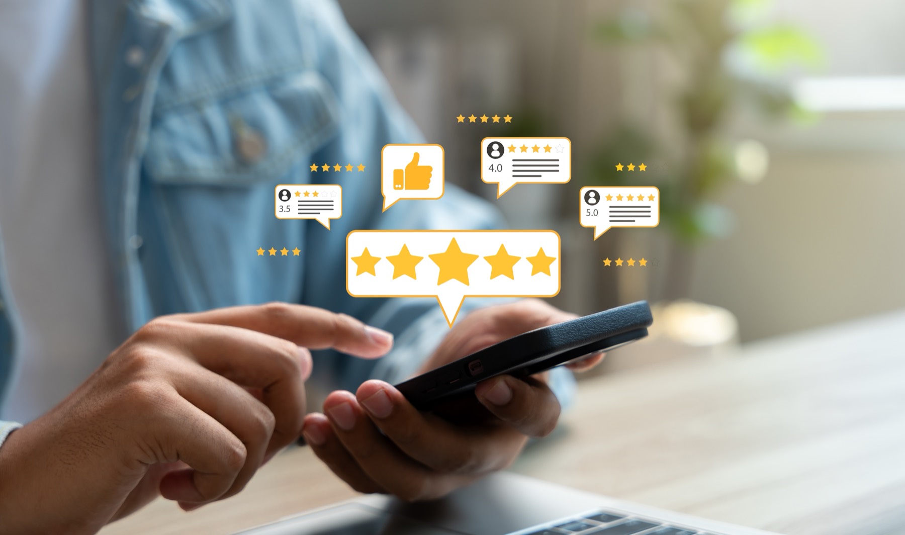 Person reading five star review ratings on a smartphone at a desk