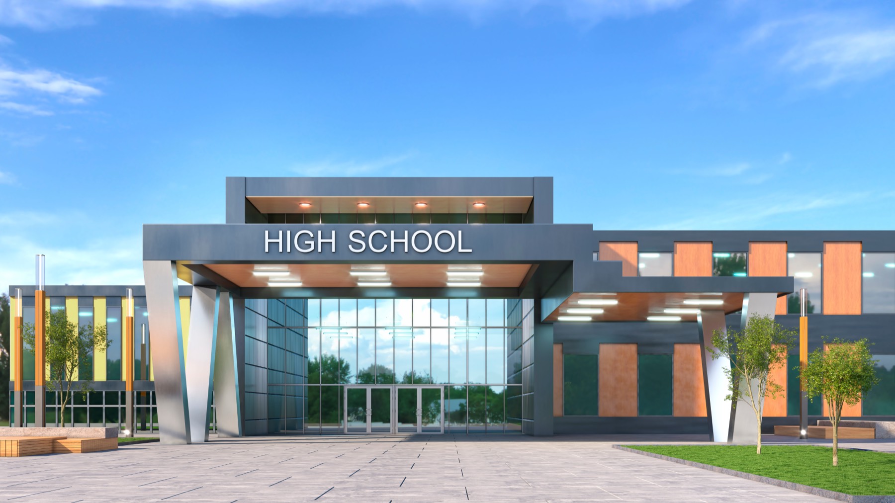 Glass entrance of a modern high school building on a clear day